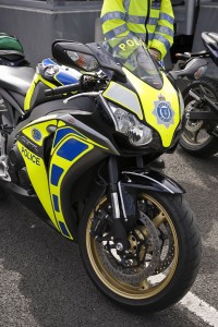 front shot of a race replica sports bike with police markings.