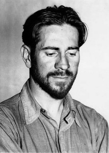 A black and white head and shoulders portraint photograph of a bearded Ed Ricketts in his '30s.