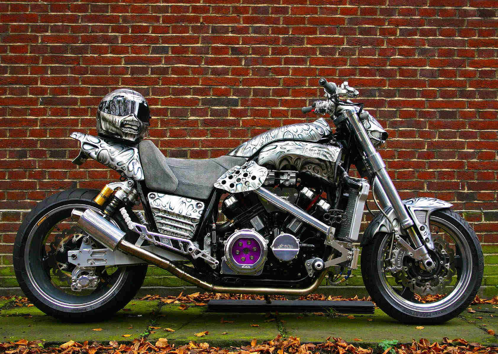 Iron Maiden's low rider motorcycle, with helmet on saddle, customised to suit their mascot Eddie the Head.