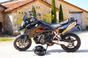 Side view of the KTM, parked outside Pierre's premises.