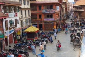 Town square in kahtmandu with lots of parked bikes