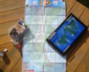 Looking down on a map and other navigational equipment on a table