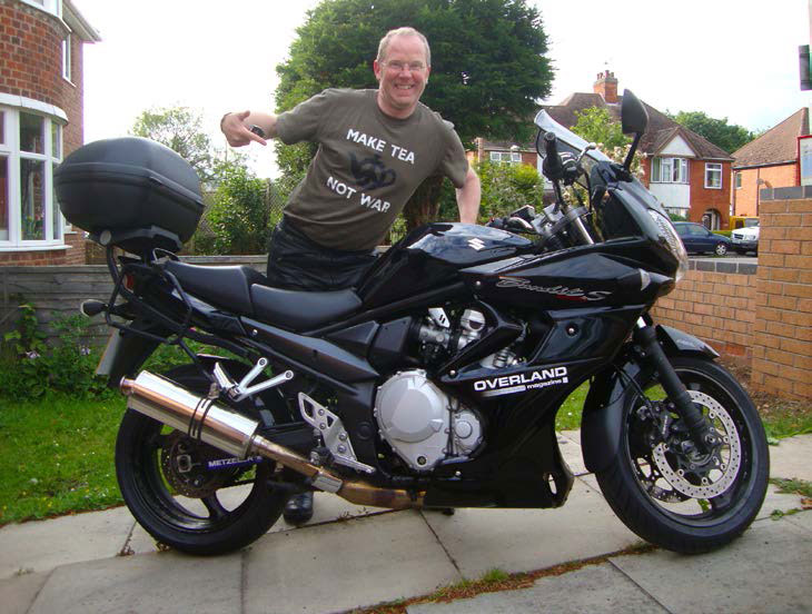 Paddy standing next to his Yamaha